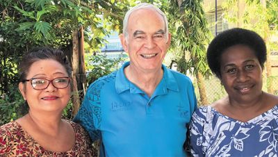 Fr. Frank, with Lilian (left) and Vitalina (right)