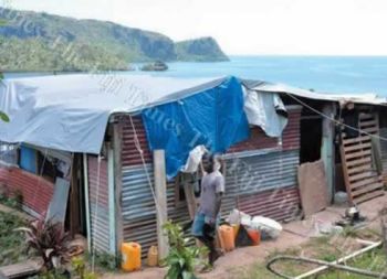 Ten months after the cyclone families are still living in tents and scraps put together to build dwellings.